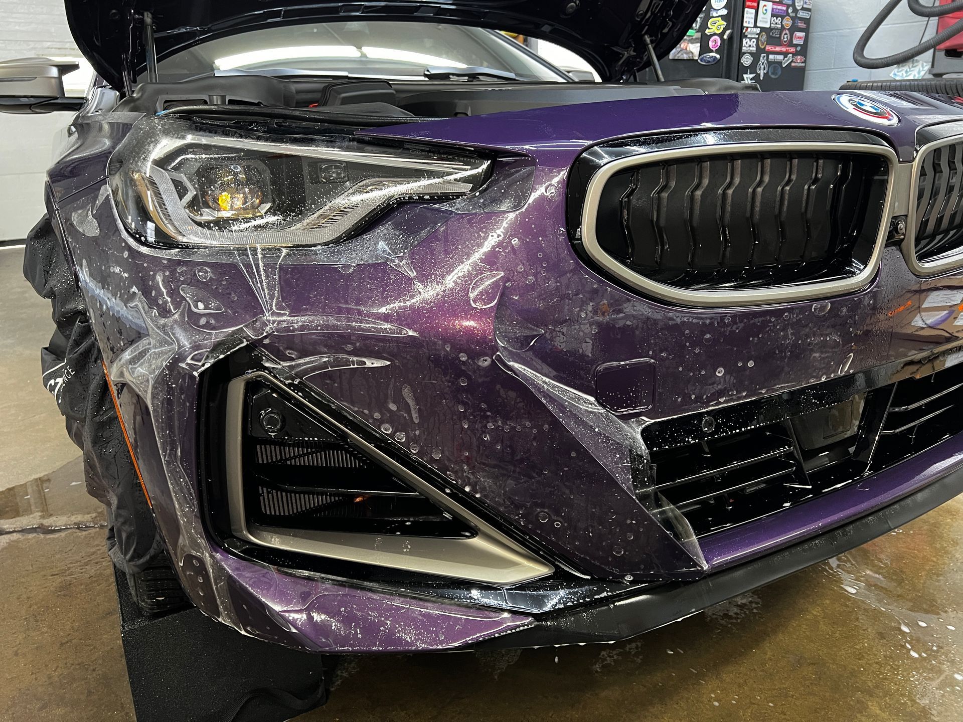 Car hood covered in clear protective film.