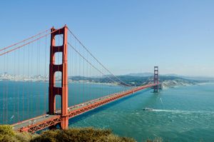 Golden Gate Bridge, San Francisco, spanning blue water on a sunny day.