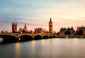 London skyline with Big Ben and Westminster Bridge at sunset.