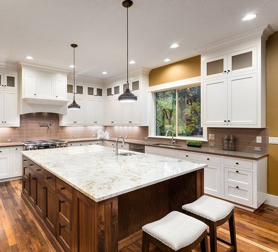 Kitchen with White Cabinets and Hardwood Floors — Pompano Beach, FL — Galaxy Marble