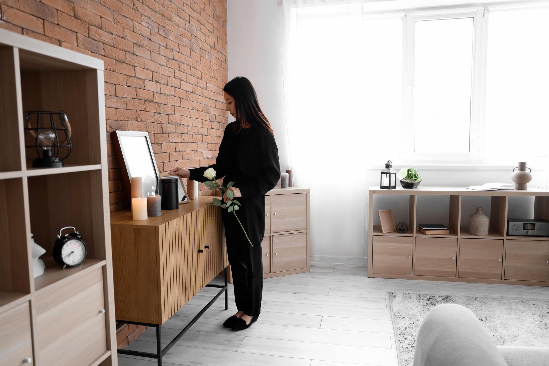 woman morning at a home memorial corner