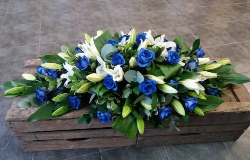 blue and white funeral flower Arrangement