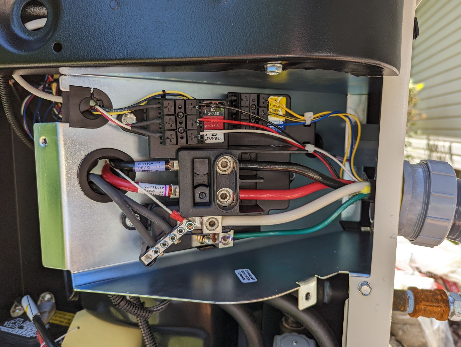 The inside of a machine with a lot of wires coming out of it.