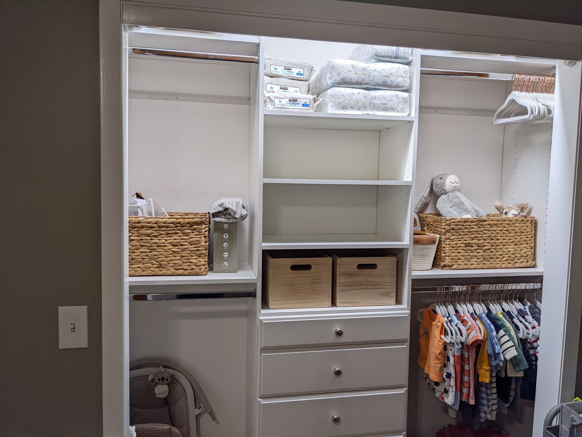 A closet filled with lots of clothes and baskets.