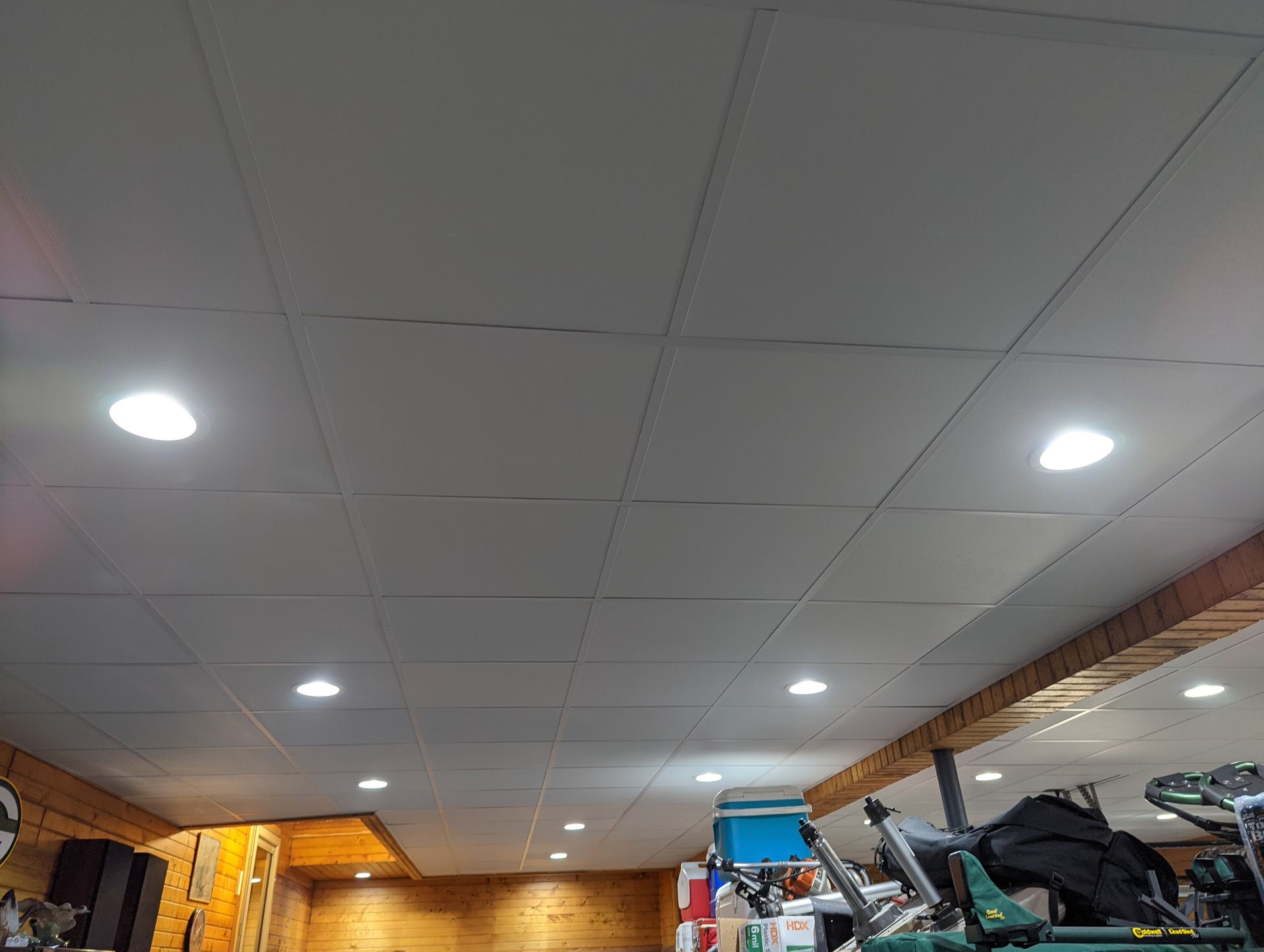 A ceiling in a room with a lot of lights on it.