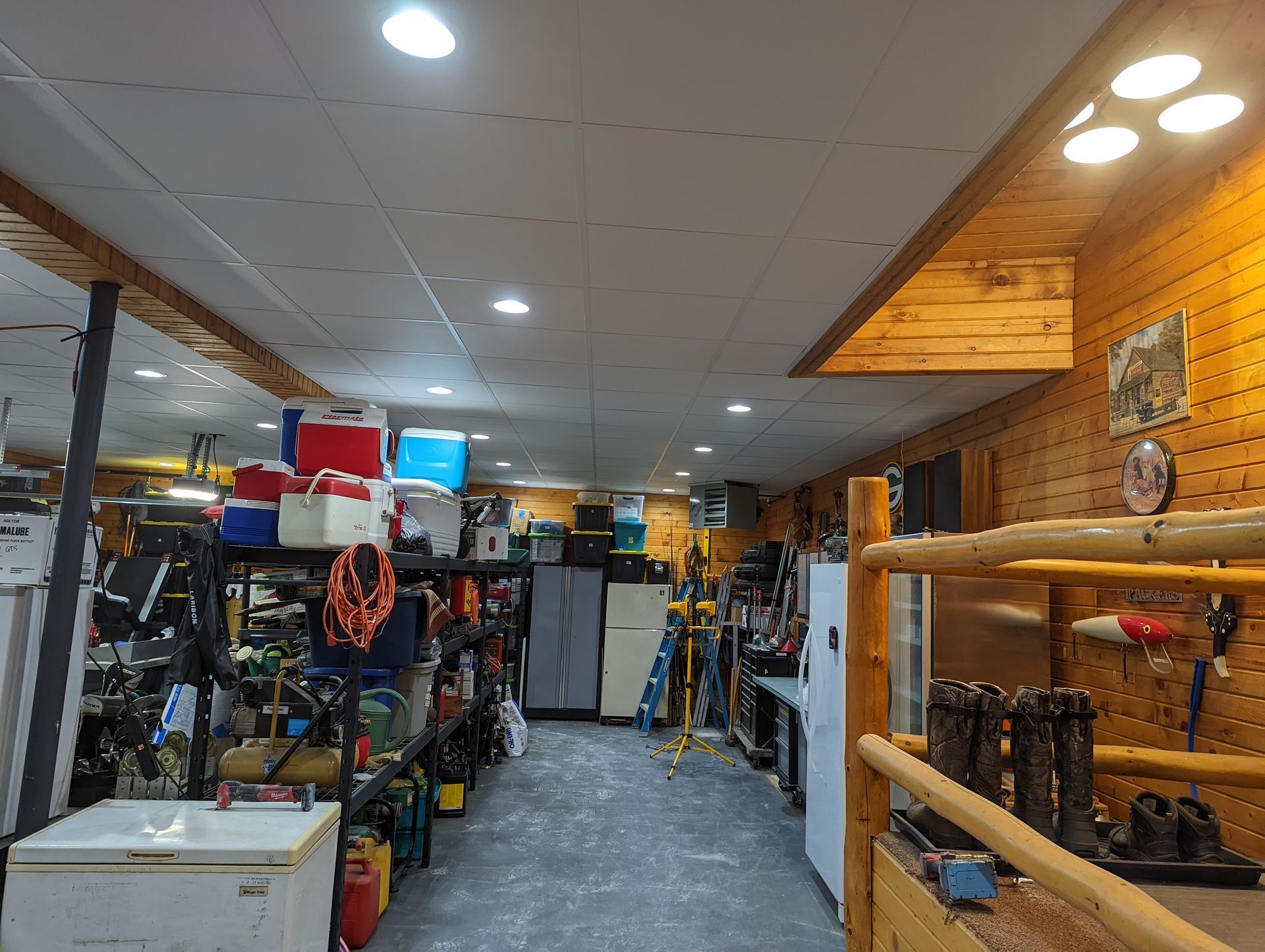 The inside of a garage with a freezer in the middle