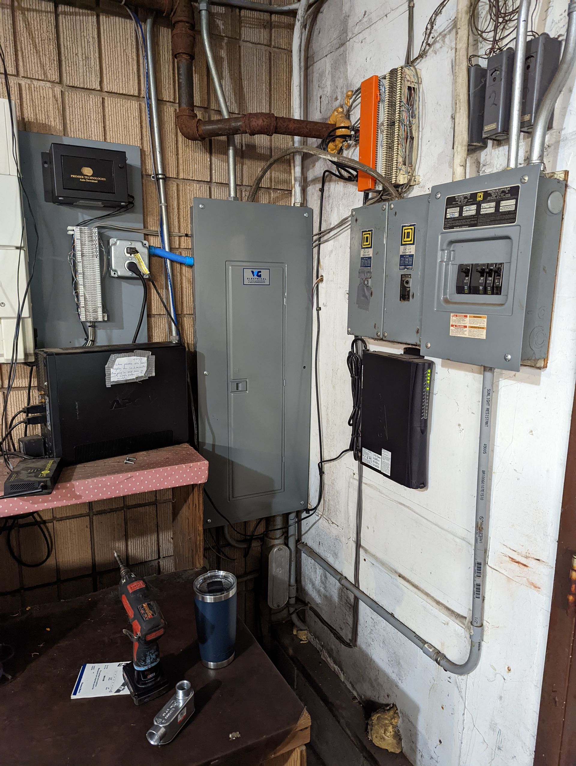 A room with a lot of electrical equipment on the wall.