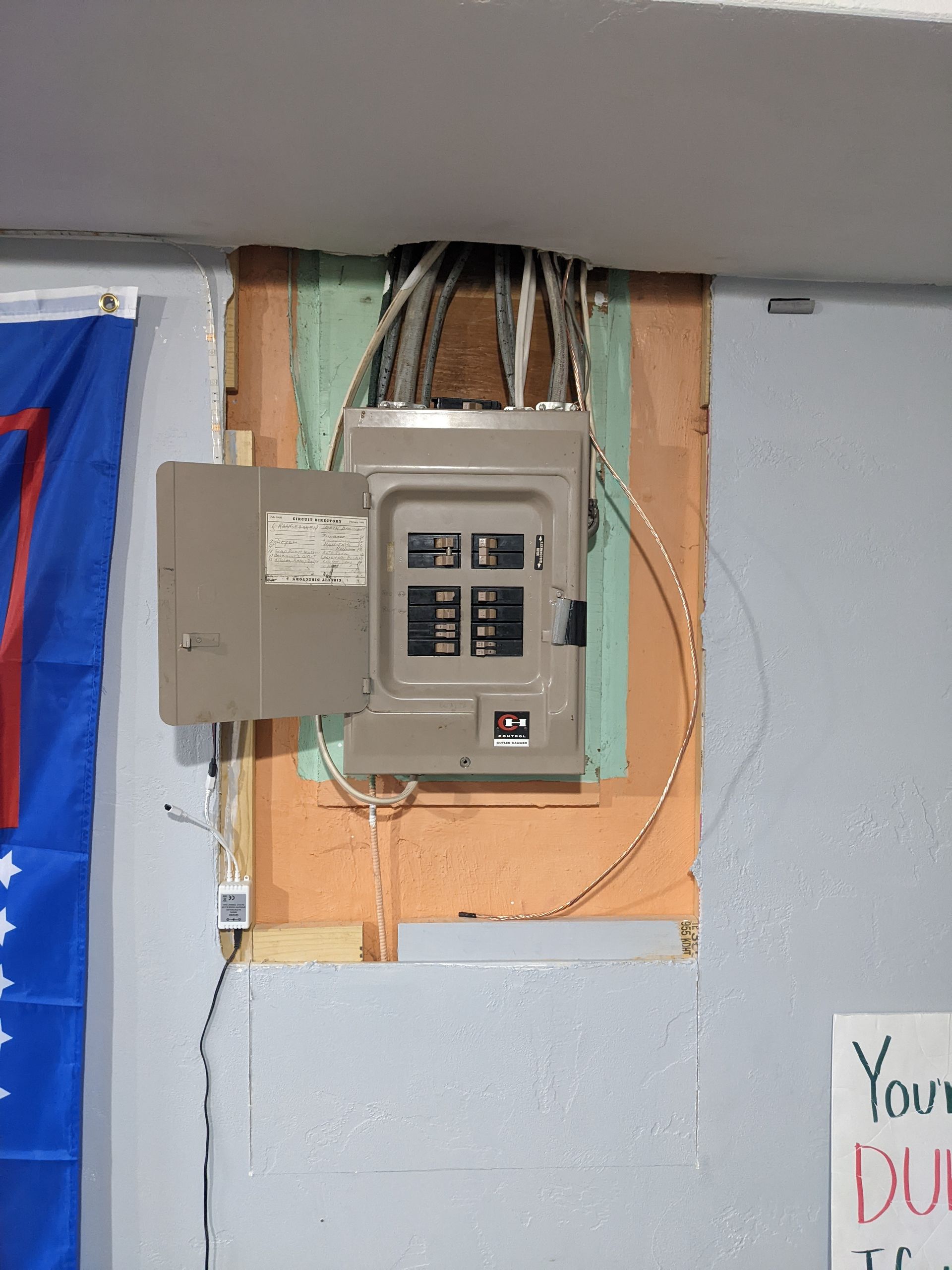 A sign on a wall that says your dues