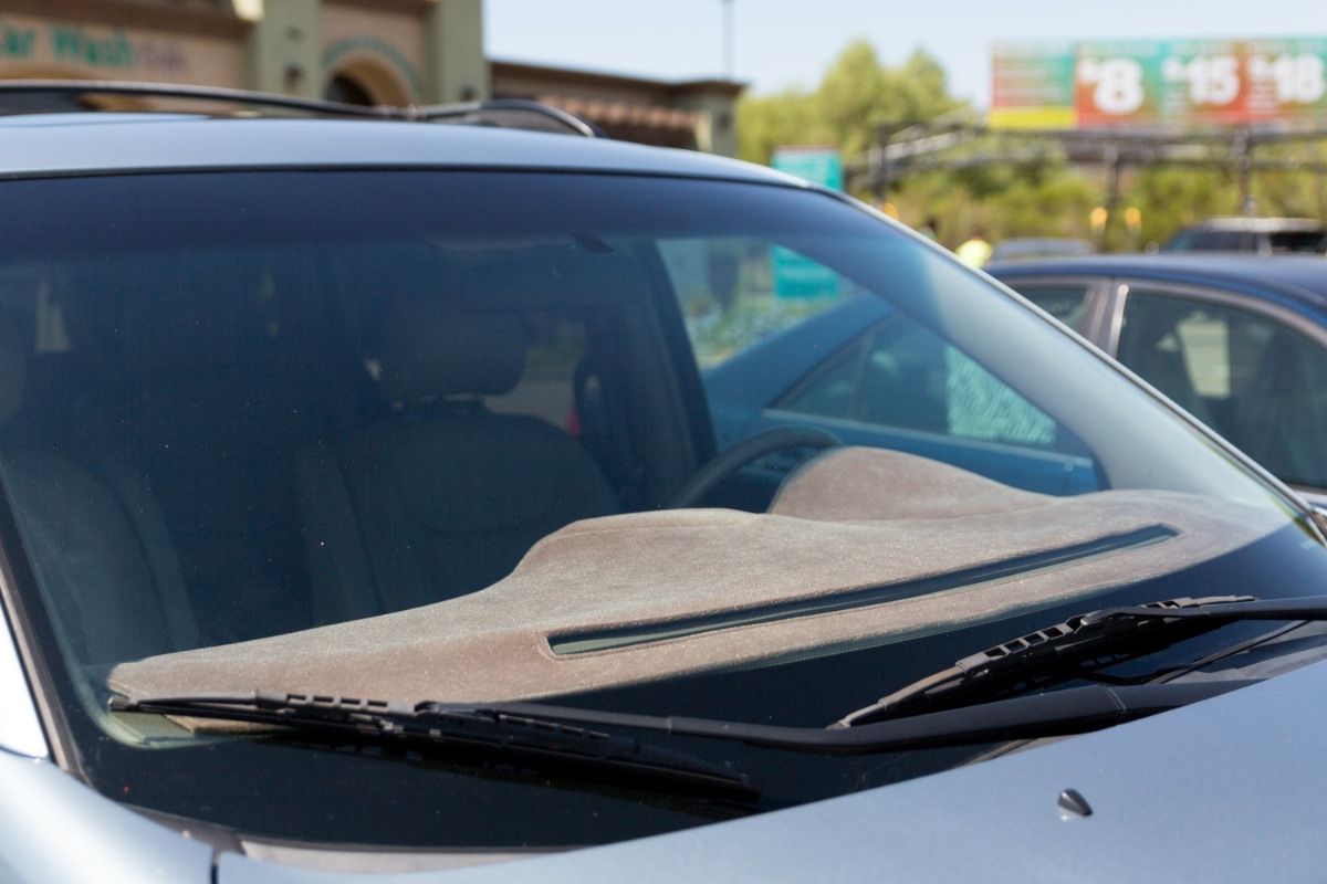 A car with a wiper cover on the windshield