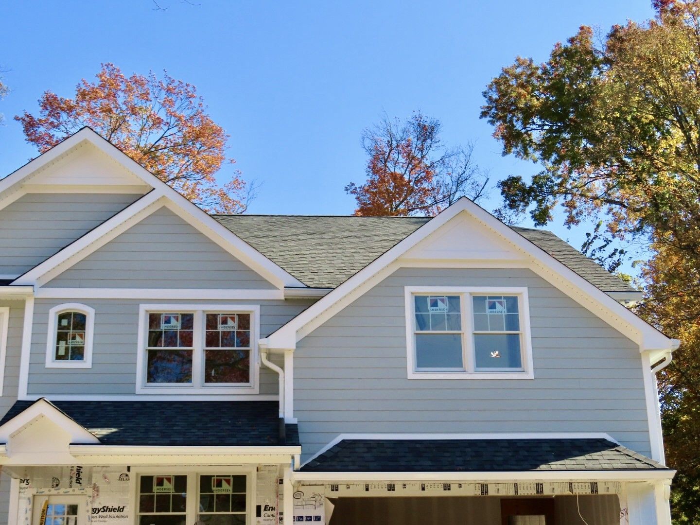 The front of a house with a blue sky in the background