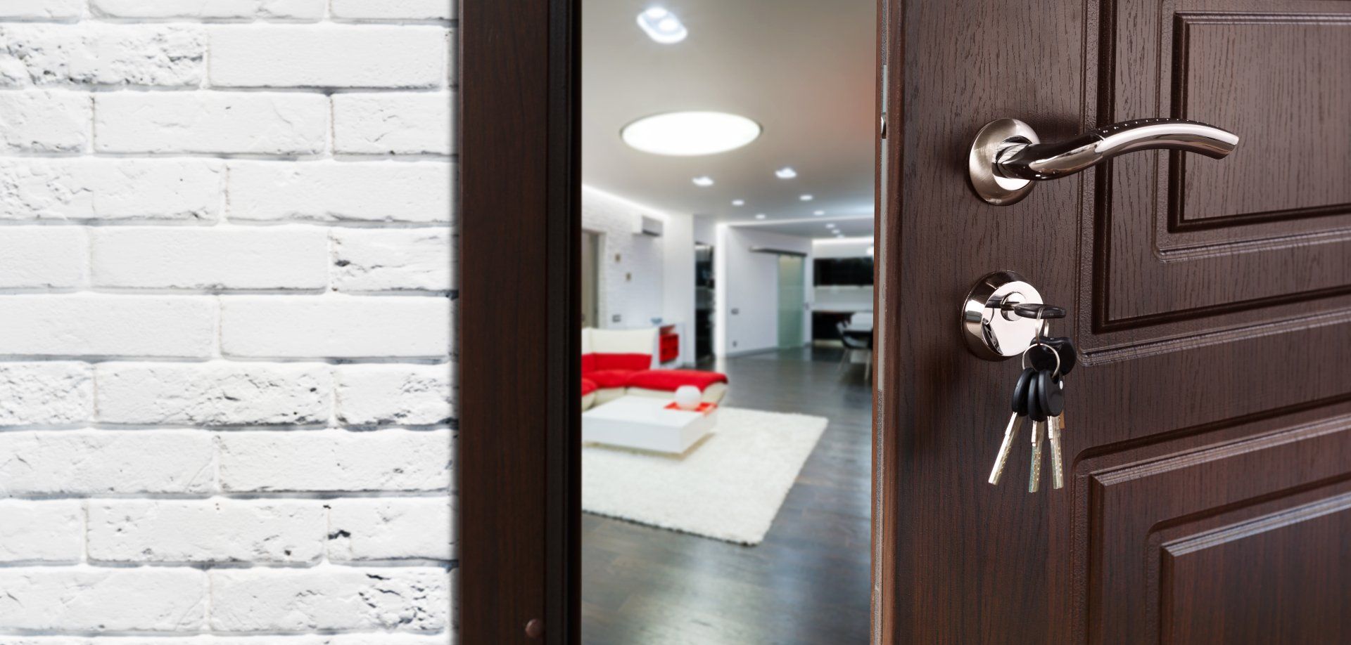 Half opened door to a living room. Door handle, door lock. Lounge door half open.