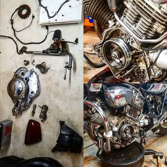 A motorcycle engine is being worked on in a garage.