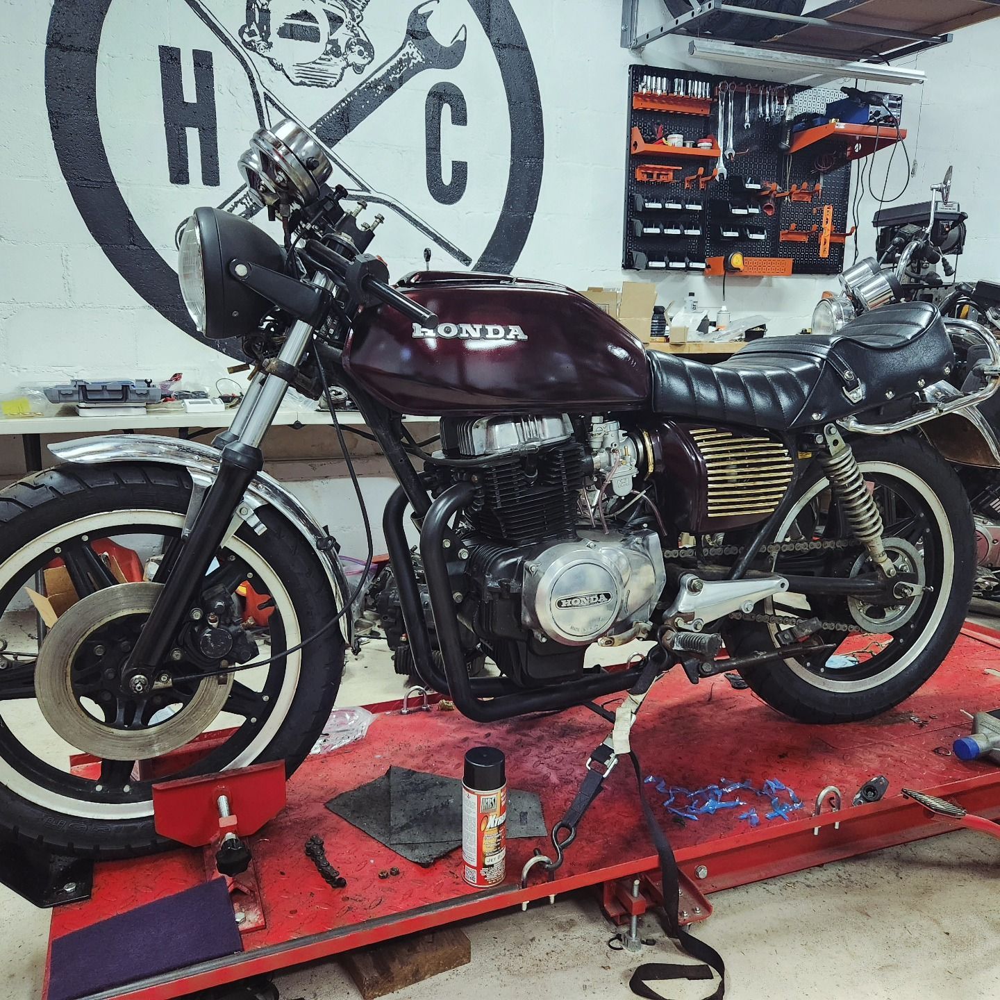 A honda motorcycle is being worked on in a garage