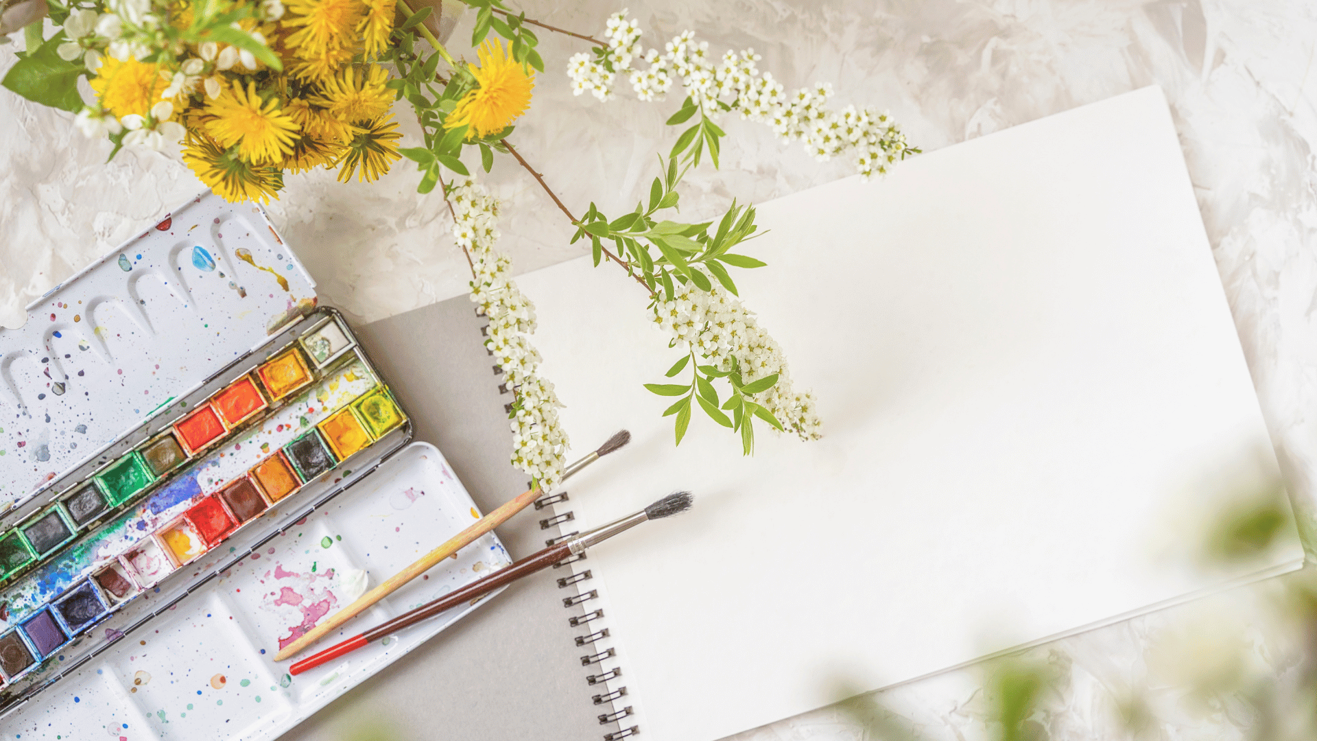 A peaceful art therapy space at Mehana Wellness featuring watercolor paints and brushes