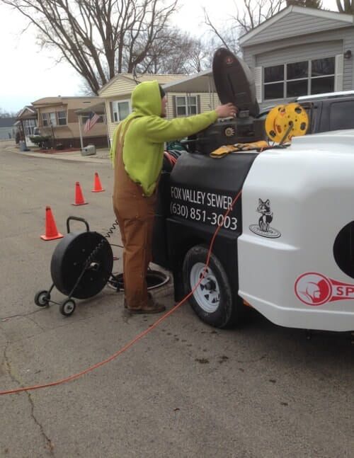 Technician inspecting equipment - jetting services in Montgomery, IL