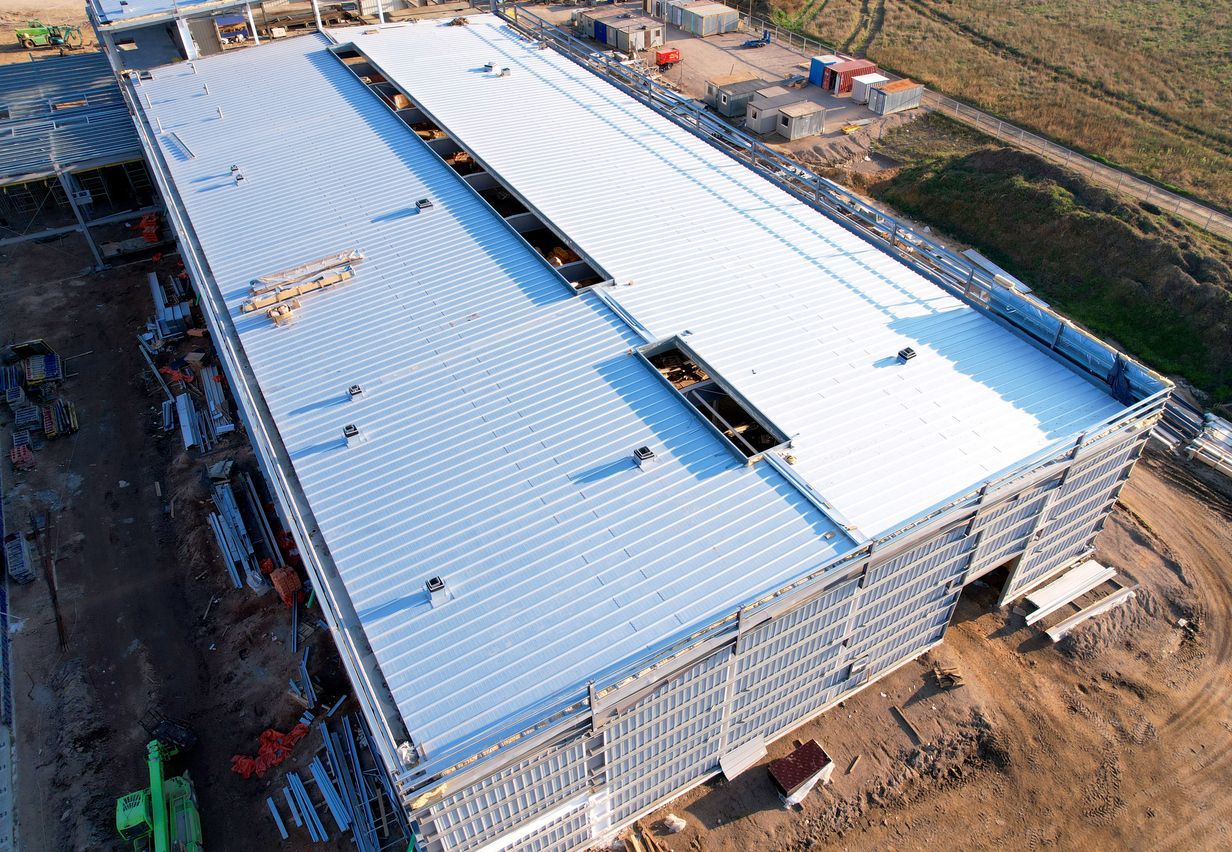 An aerial view of a large building under construction.