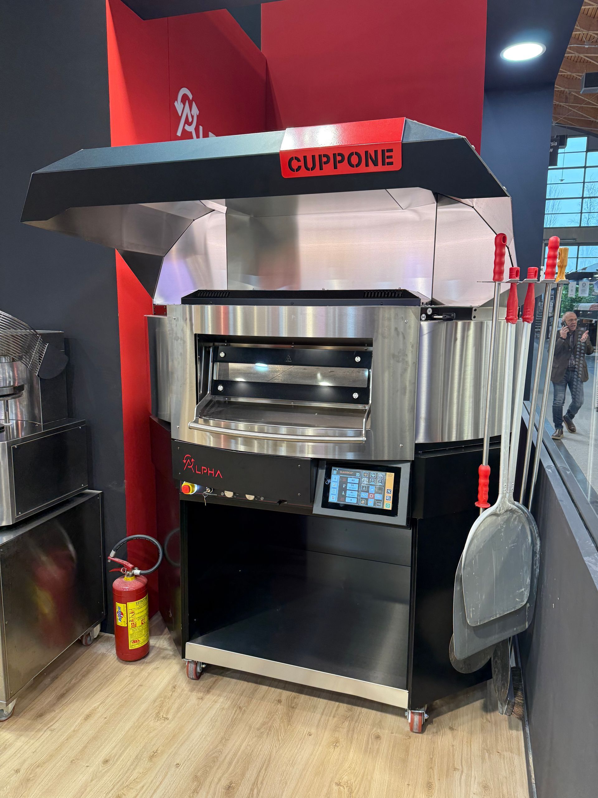 Cuppone Delta pizza oven in stainless steel for professional kitchens
Chef baking pizza in Cuppone Alpha oven with digital controls
Cuppone commercial pizza oven installed in modern pizzeria
Cuppone PizzaForm dough press machine preparing fresh pizza bases
Close-up of Cuppone HE400 pizza oven with energy-efficient design
Cuppone Italian pizza ovens showcased at Fine Food Sydney exhibition