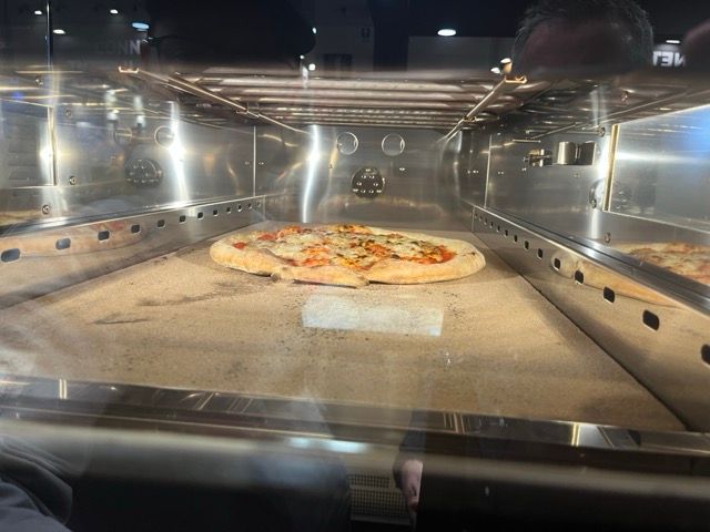 Cuppone Delta pizza oven in stainless steel for professional kitchens
Chef baking pizza in Cuppone Alpha oven with digital controls
Cuppone commercial pizza oven installed in modern pizzeria
Cuppone PizzaForm dough press machine preparing fresh pizza bases
Close-up of Cuppone HE400 pizza oven with energy-efficient design
Cuppone Italian pizza ovens showcased at Fine Food Sydney exhibition
