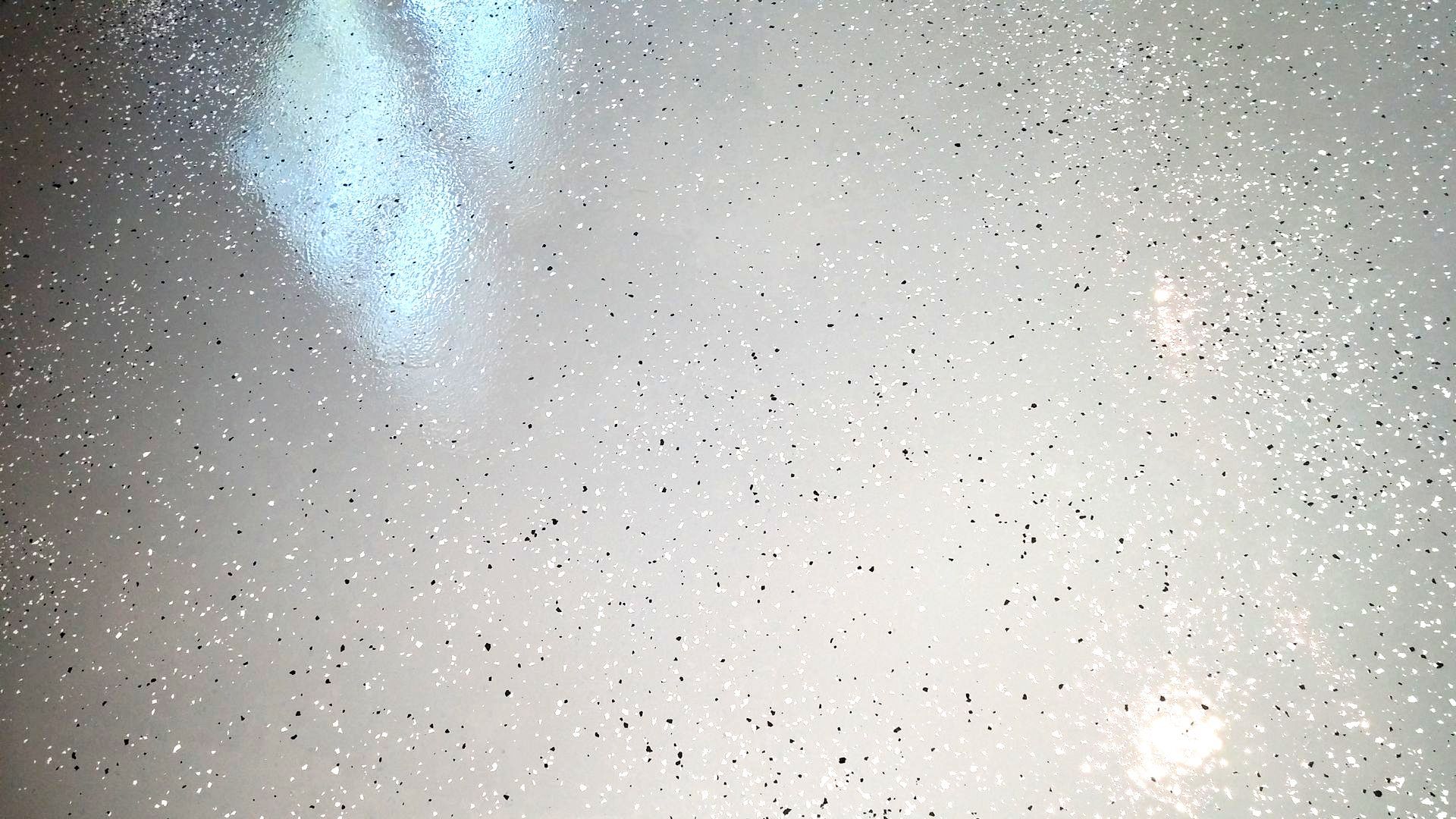 A white surface with a lot of glitter on it