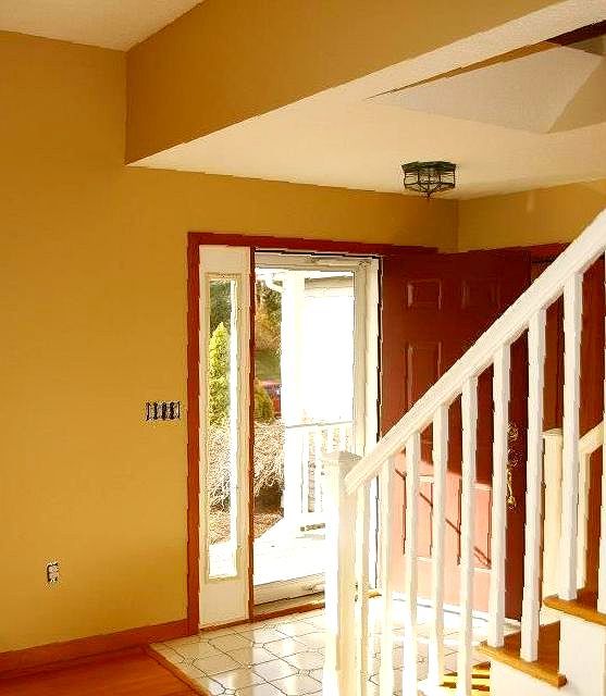 A room with a staircase and a door that says tejani