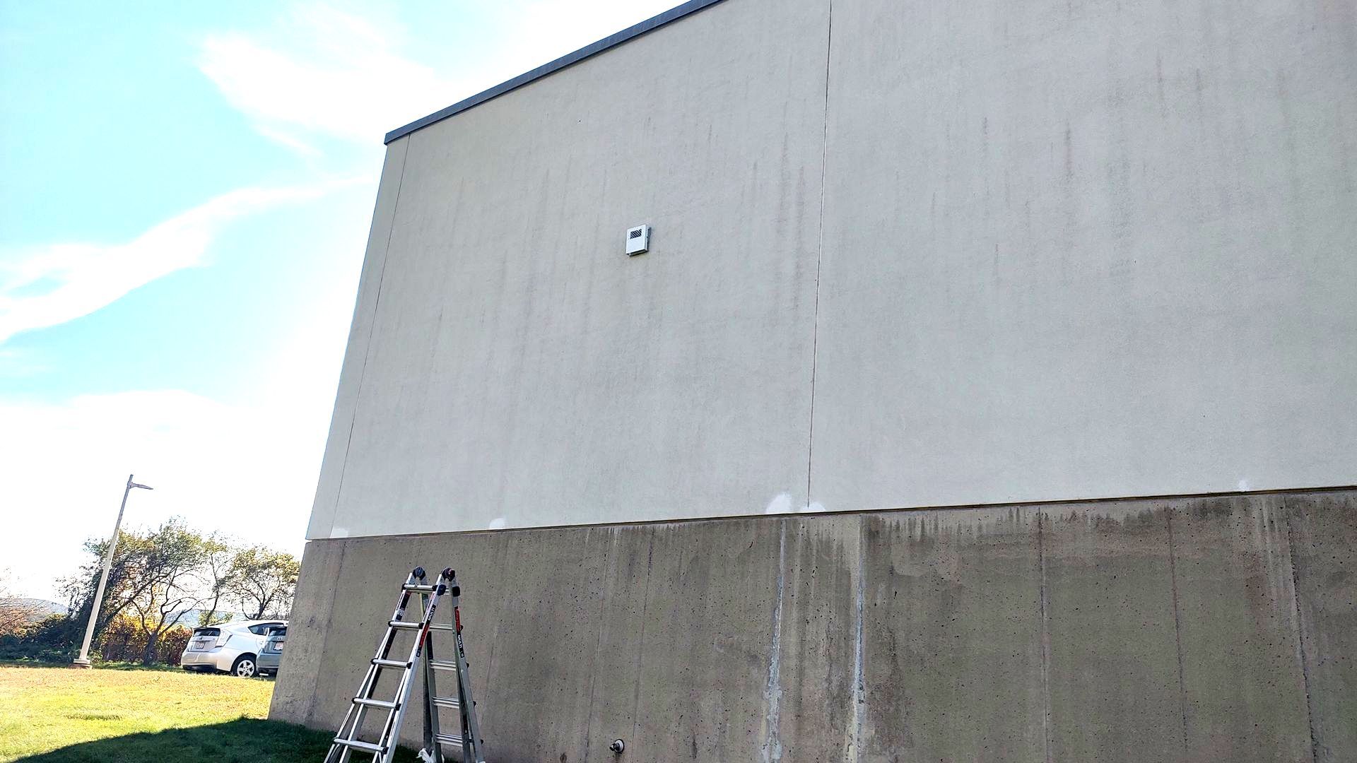 A ladder is leaning against the side of a building.