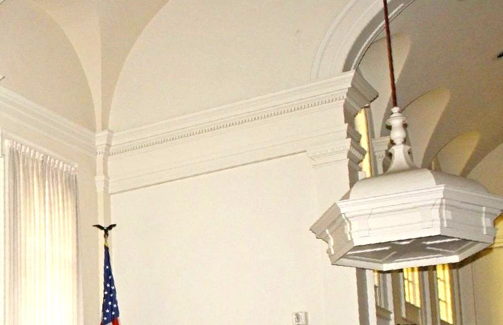 An american flag is hanging from the ceiling of a building