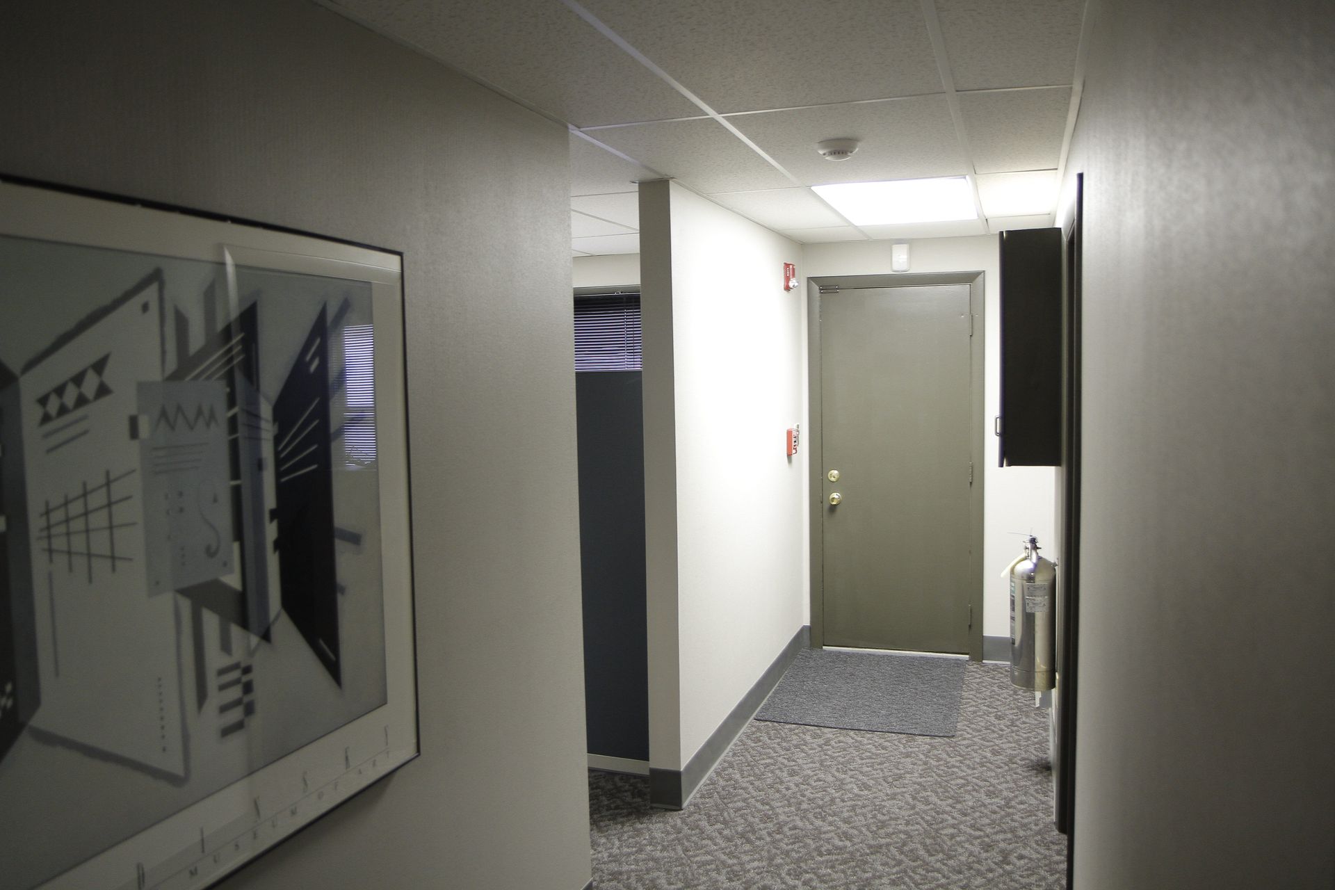 A hallway with a picture on the wall 