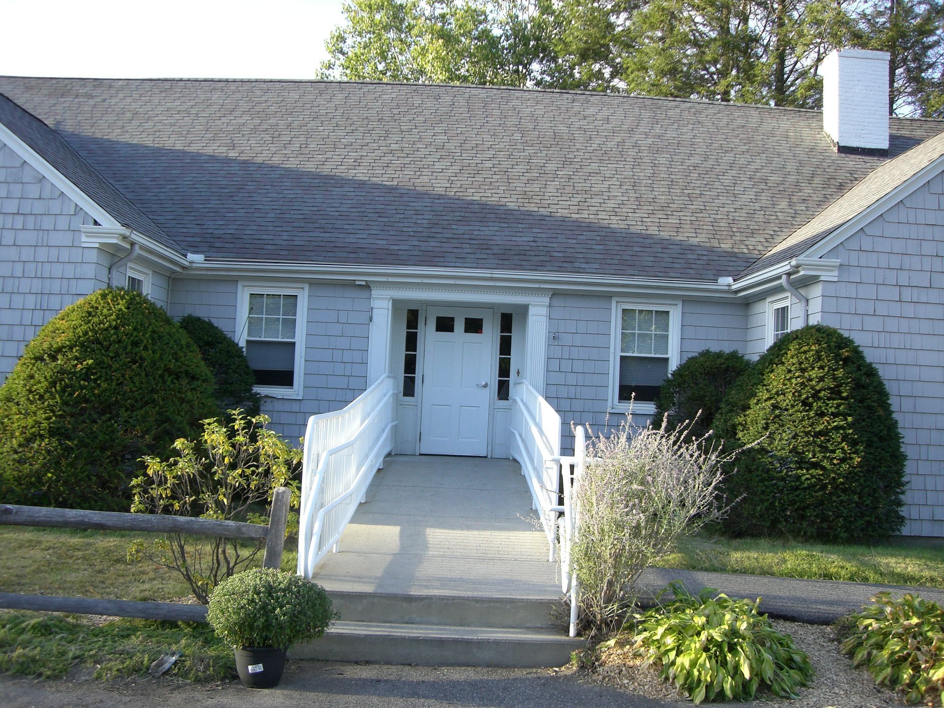 A house with a ramp leading to the front door