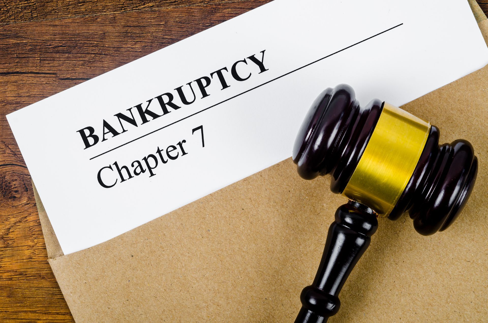 Bankruptcy documents with a wooden gavel, symbolizing legal and business concepts. Bankruptcy documents with a wooden gavel, symbolizing legal and business concepts.