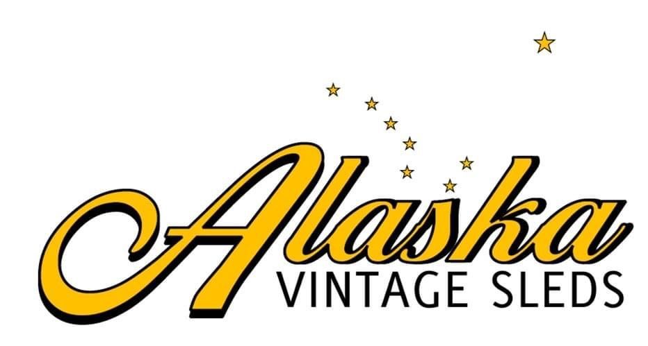 A yellow and black logo for alaska vintage sleds