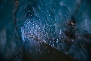 Inside the stunning Castner Ice Cave, Castner Glacier. Book a guided hike to Castner with the Lodge at Black Rapids