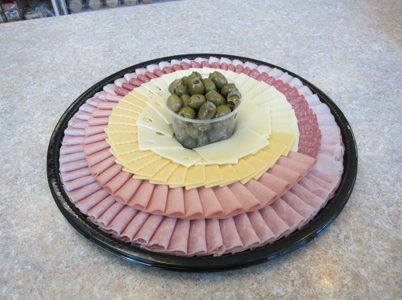 On Plate Foods — ham and cheese rounded on plate with veggies at the center in Orland Park, IL