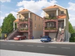 A couple of houses with cars parked in front of them