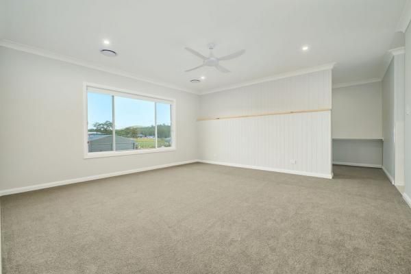 An Empty Room With A Large Window and A Ceiling Fan | Mid-North Coast, NSW | BDM Constructions