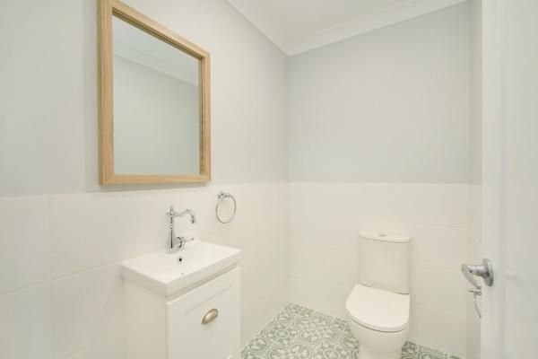 A Bathroom with A Toilet, Sink and Mirror | Mid-North Coast, NSW | BDM Constructions
