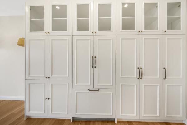 A Wall of White Cabinets with Glass Doors | Mid-North Coast, NSW | BDM Constructions