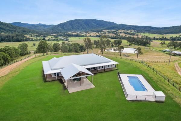 An Aerial View of A House with A Pool and Mountains | Mid-North Coast, NSW | BDM Constructions