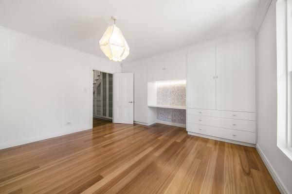 An Empty Room with Hardwood Floors and White Walls | Mid-North Coast, NSW | BDM Constructions