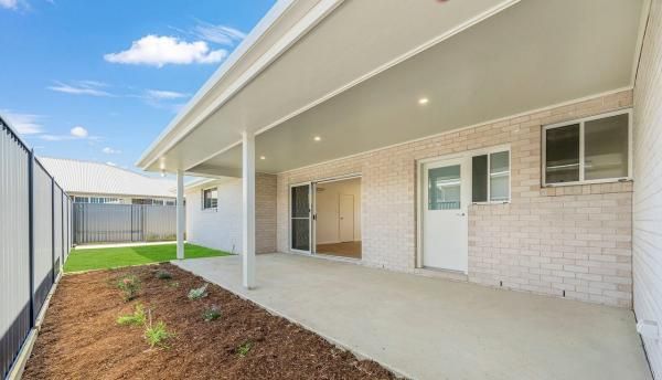 The Backyard of A House with A Covered Patio and A Fence | Mid-North Coast, NSW | BDM Constructions