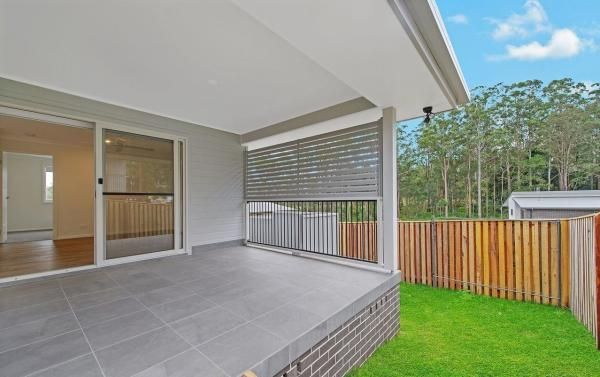 A Patio with A Wooden Fence and A Sliding Glass Door | Mid-North Coast, NSW | BDM Constructions