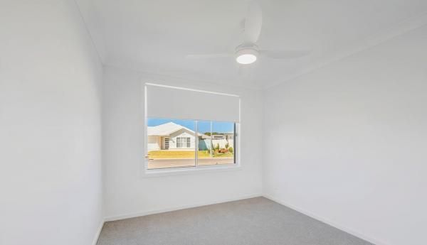An Empty Room with A Window and A Ceiling Fan | Mid-North Coast, NSW | BDM Constructions