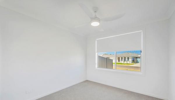 An Empty Room with A Large Window and A Ceiling Fan | Mid-North Coast, NSW | BDM Constructions