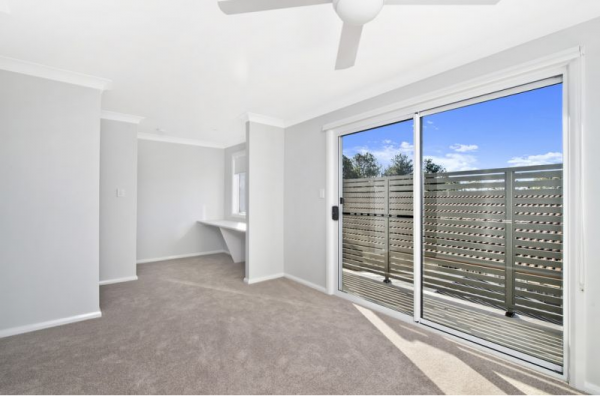 An Empty Room with A Sliding Glass Door and A Ceiling Fan | Mid-North Coast, NSW | BDM Constructions
