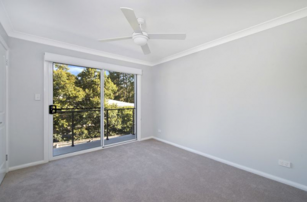 An Empty Room with A Ceiling Fan and Sliding Glass Doors | Mid-North Coast, NSW | BDM Constructions