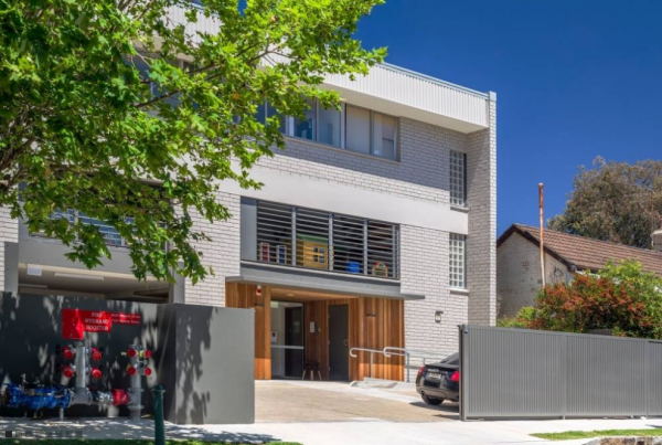 A Large White Building with A Car Parked in Front of It | Mid-North Coast, NSW | BDM Constructions