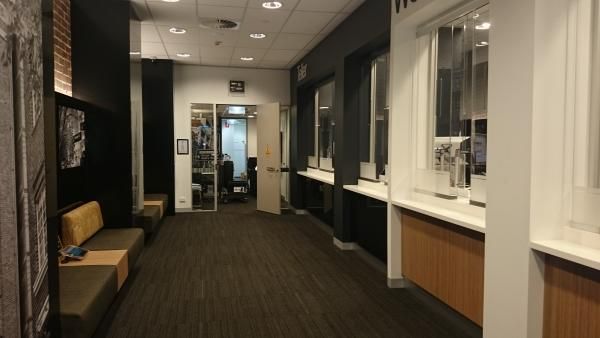 A Long Hallway with A Sign that Says Exit | Mid-North Coast, NSW | BDM Constructions