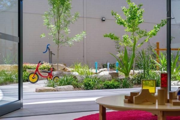 A Red Tricycle Is Parked on The Side of The Road Next to A Table | Mid-North Coast, NSW | BDM Constructions