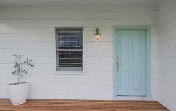 A White House with A Blue Door and A Potted Plant on The Porch | Mid-North Coast, NSW | BDM Constructions