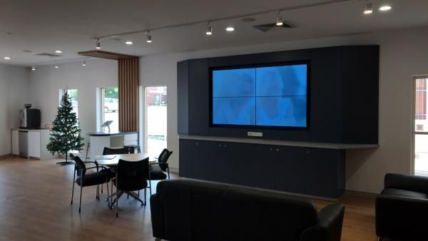 A Living Room with A Large Flat Screen Tv on The Wall | Mid-North Coast, NSW | BDM Constructions