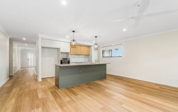 There Is a Kitchen with A Large Island in The Middle of The Room | Mid-North Coast, NSW | BDM Constructions